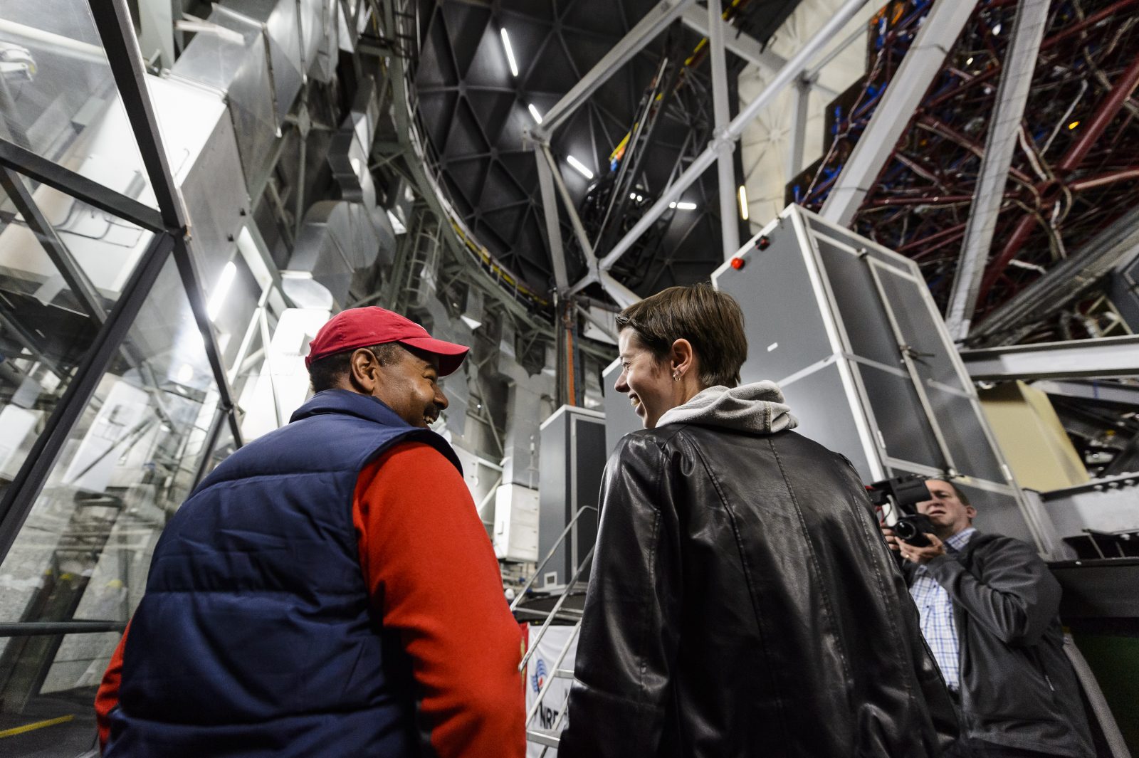 UW astronomy professor Eric Wilcots and graduate student Julie Davis take in the immensity of the SALT interior
