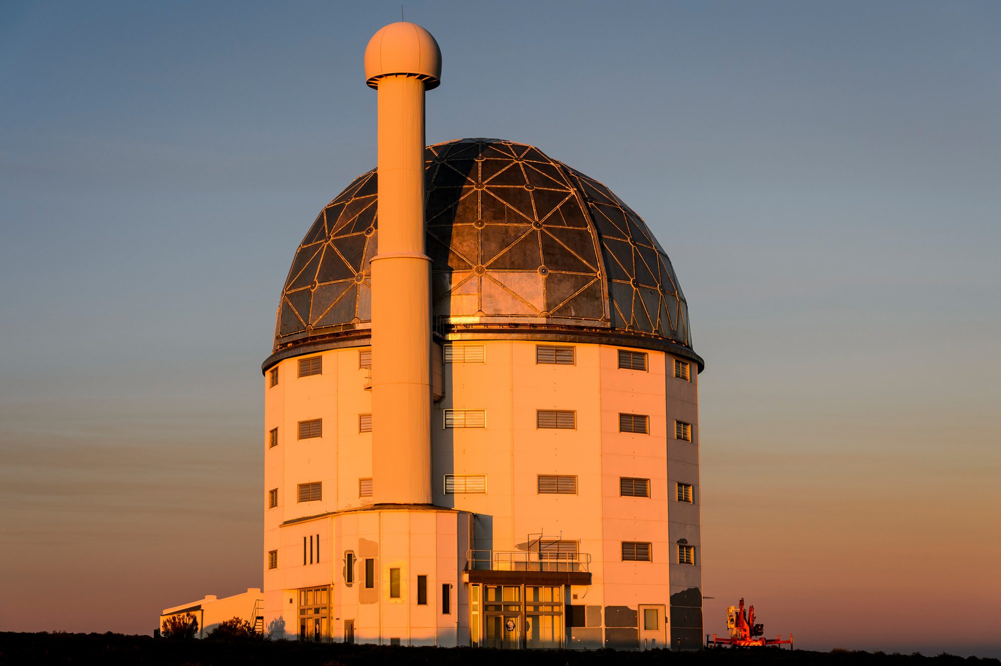 A dramatic exterior of SALT at sunset.