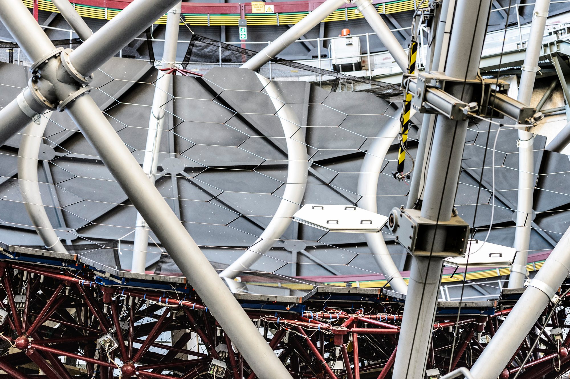 An assembly of mirrors at SALT, supported by a truss at the bottom.